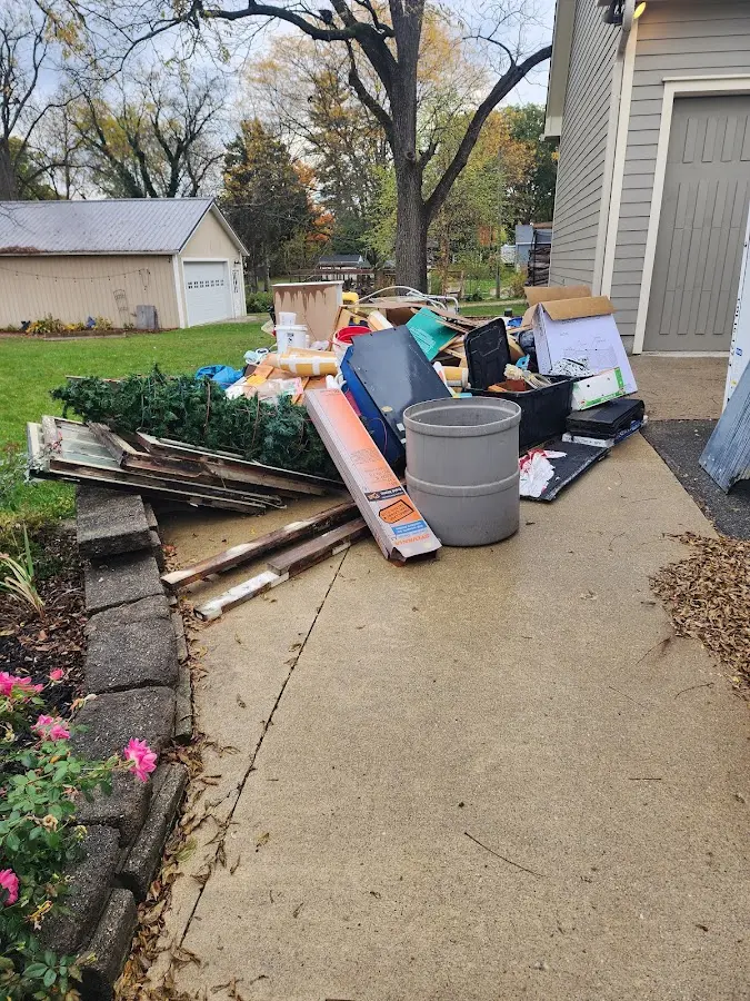 Dumpster being loaded with debris for 10 Yard Dumpster Rental in Trinidad